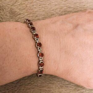 Garnet and stainless steel tennis bracelet